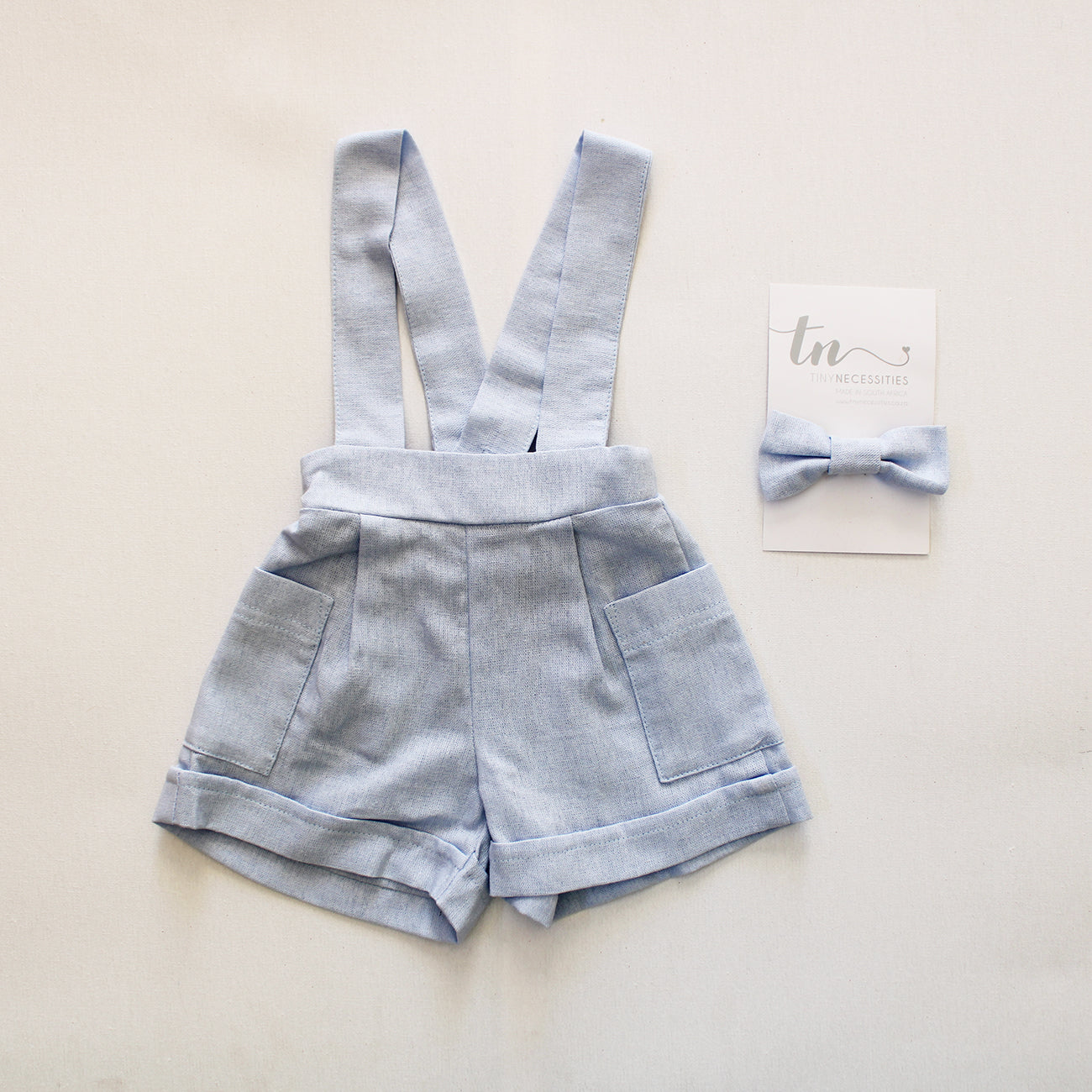 The Blue Blessing Suspender shorts (accessories + onesie sold separately)