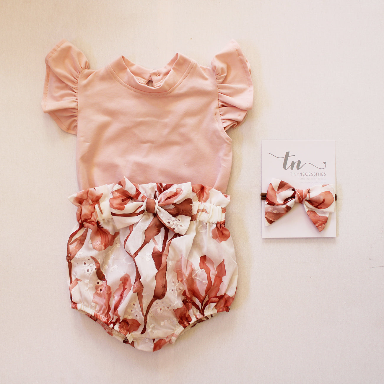 Short Sleeve Frilly Onesie - Powder Pink (bloomer + accessories sold separately)