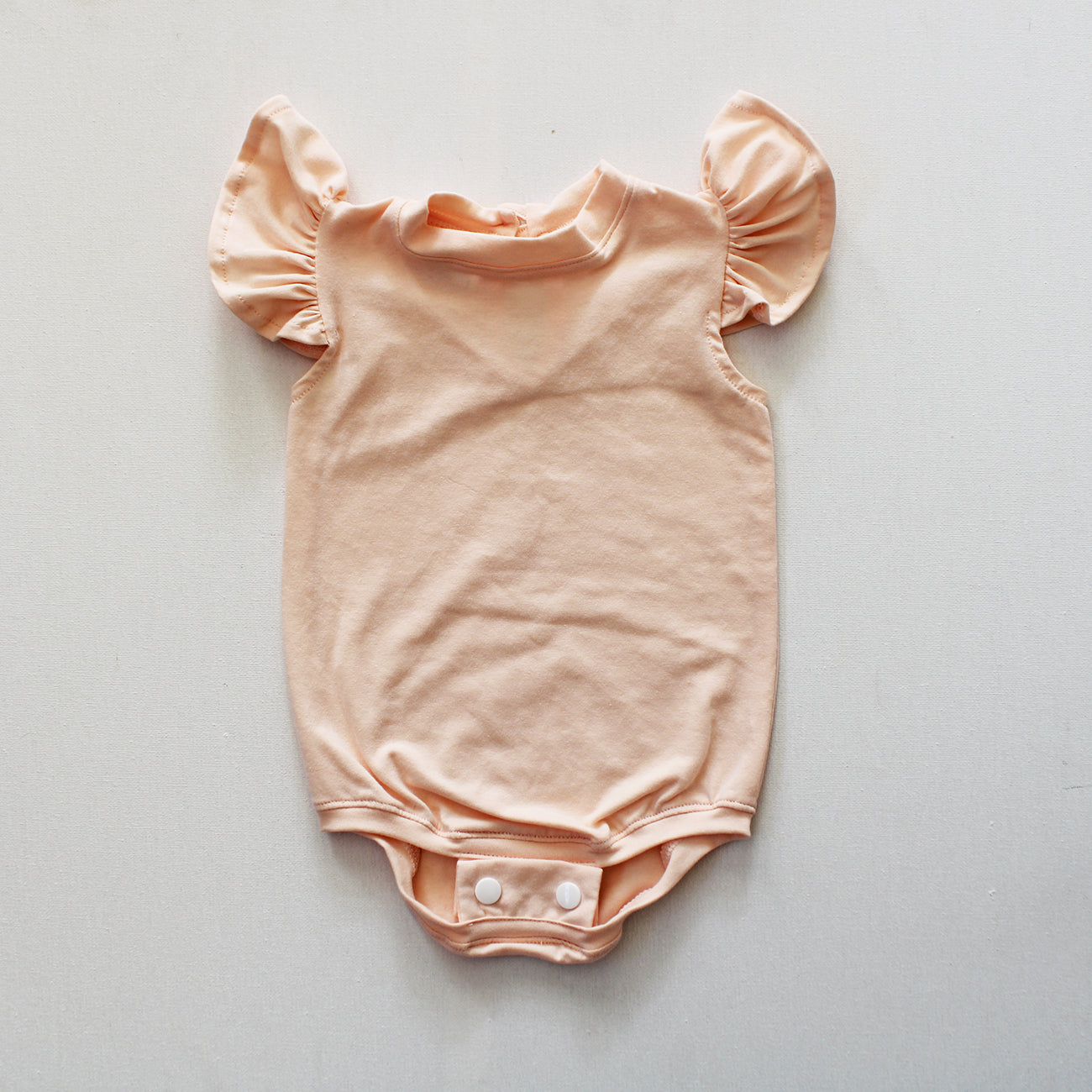 Short Sleeve Frilly Onesie - Peach Parfait (bloomer + accessories sold separately)